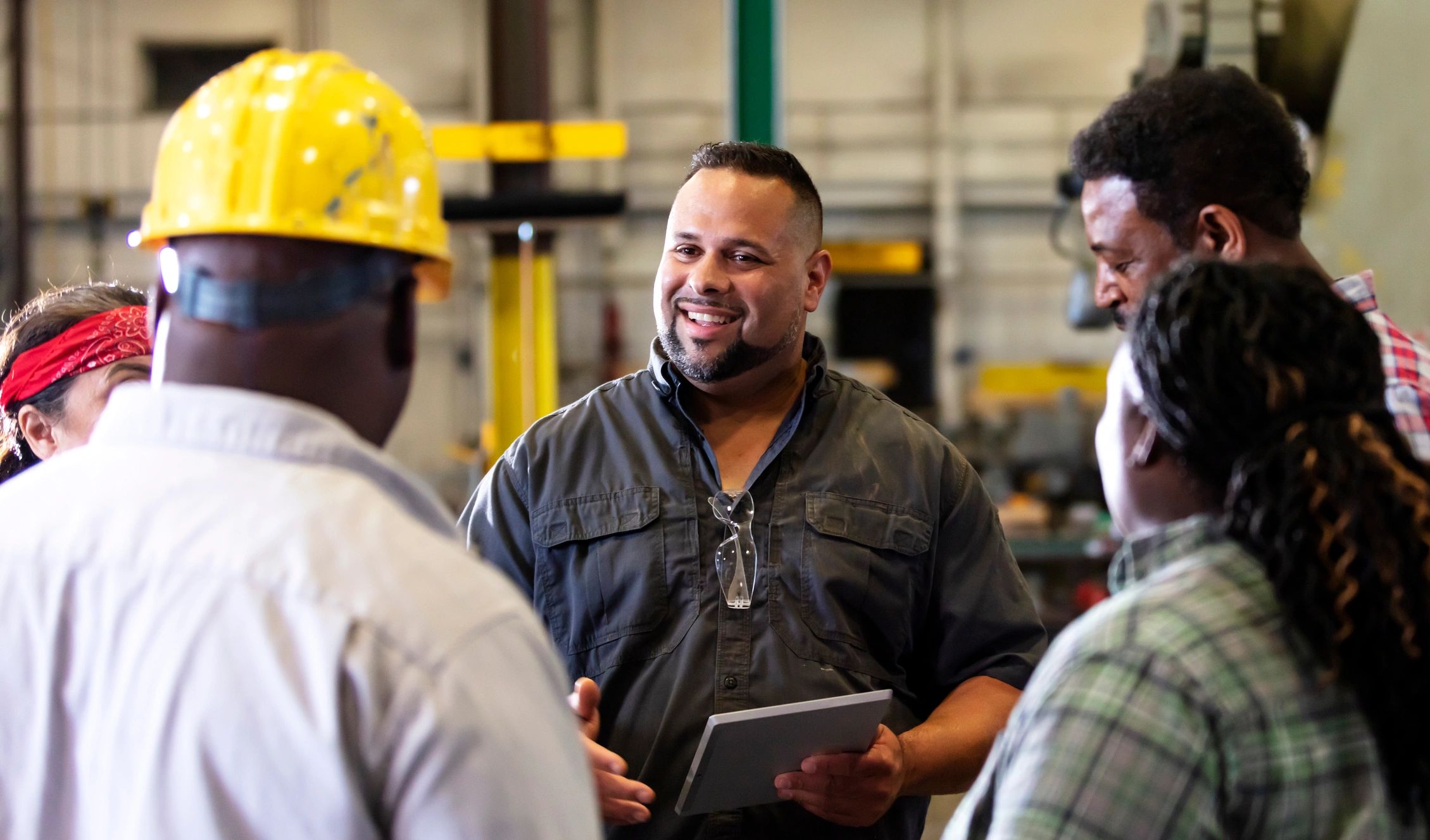 Contractor team reviewing project details on an industrial floor