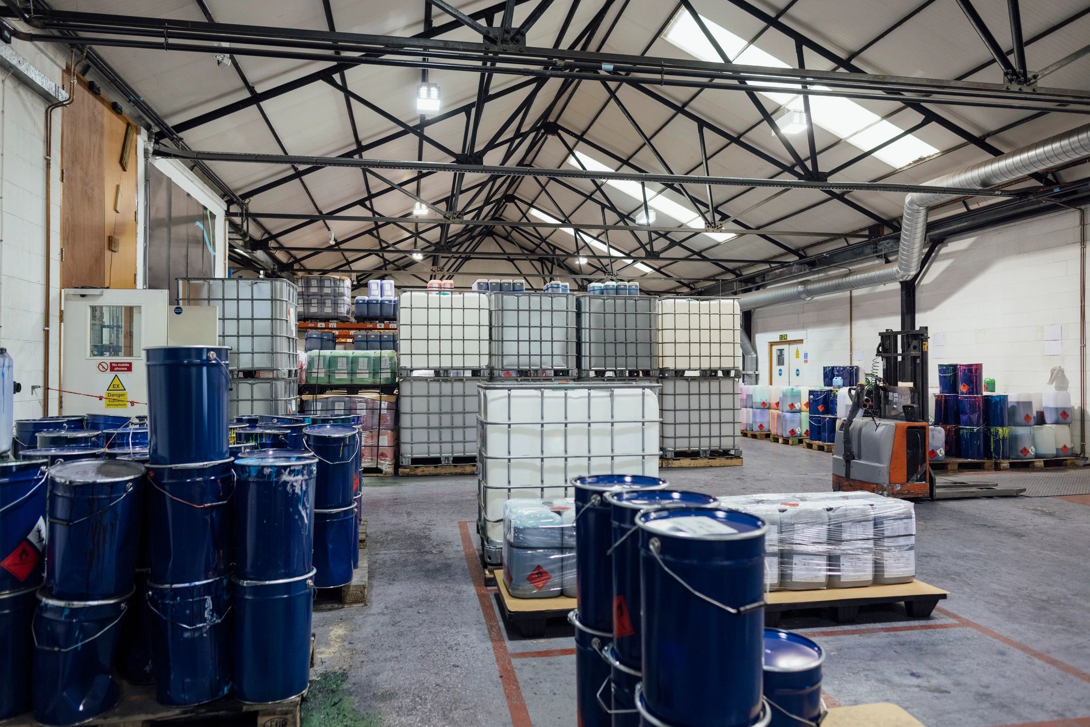 Industrial warehouse interior with concrete floor and equipment